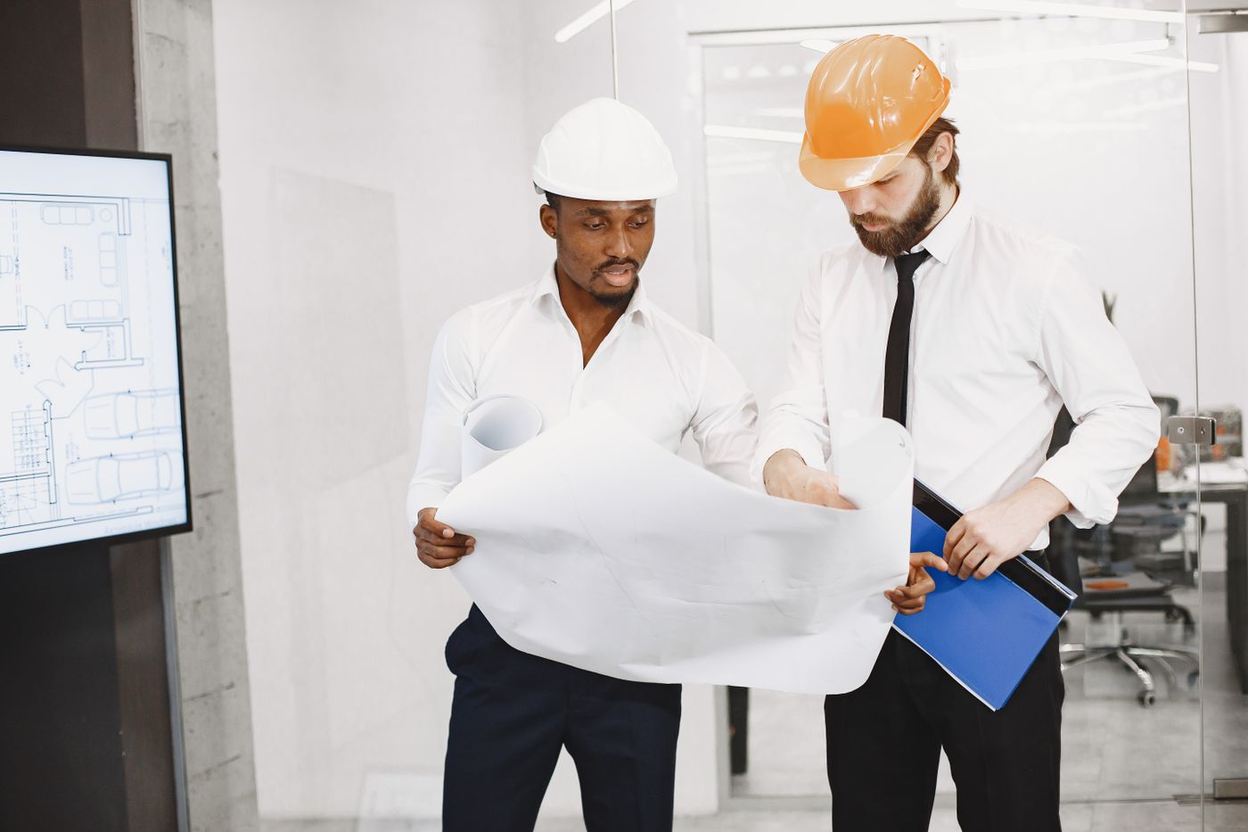 Architects reviewing building plans